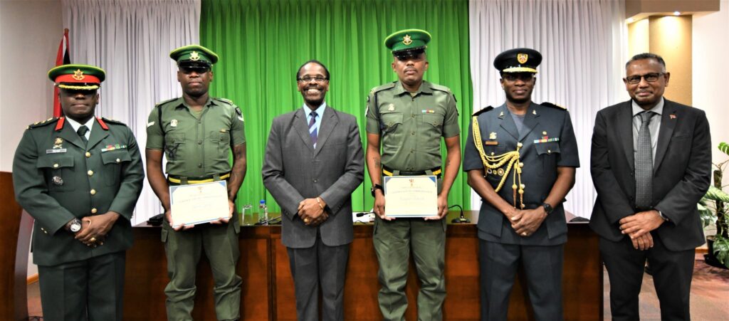 Minister Hinds commends members of the Regiment for apprehending robbery suspects on July 23, 2022.