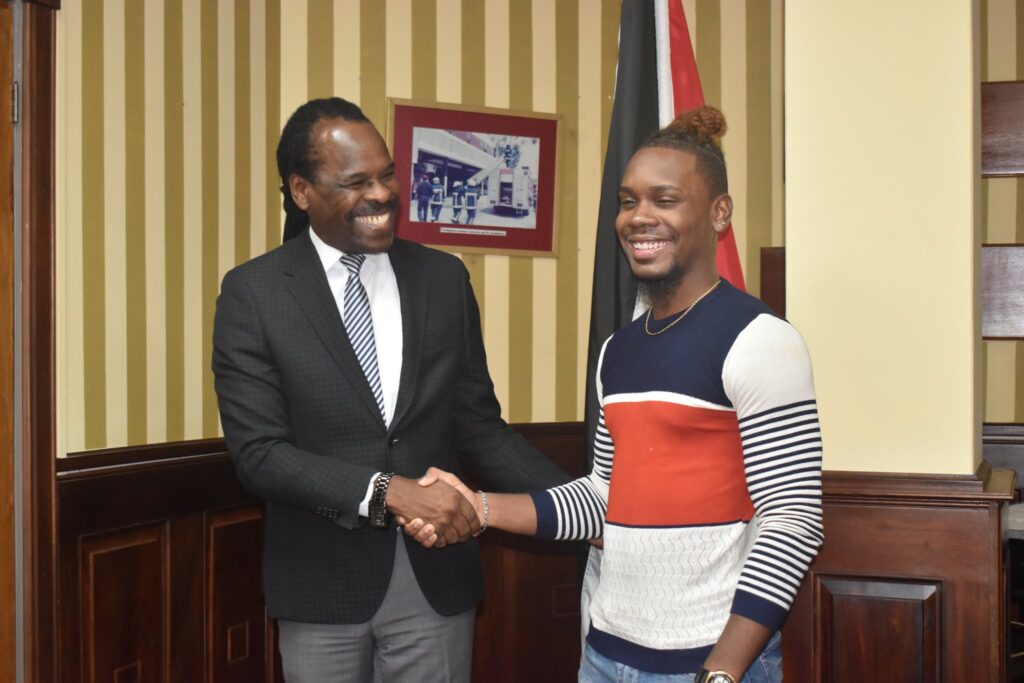 Minister Hinds meets with the winner of the National Drug Council’s Ndctt Tik Tok Challenge, Miland Holloway on Wednesday 10th August, 2022 for a brief prize distribution ceremony.